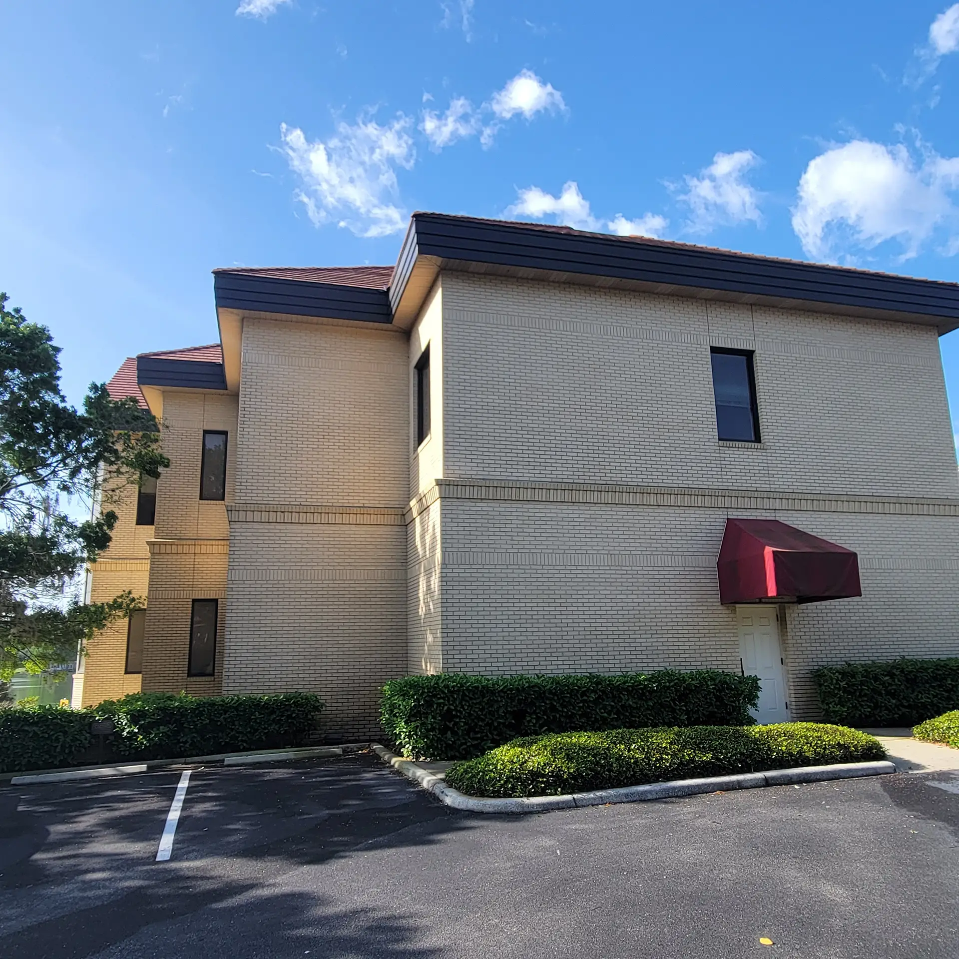 Thorough pressure washing of a commercial building's exterior, enhancing its visual appeal